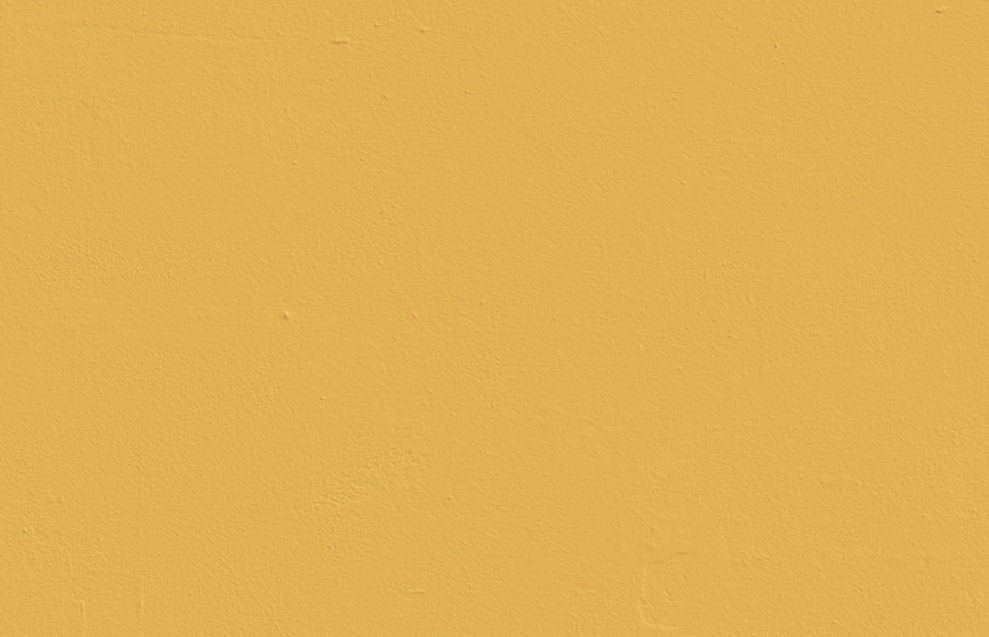 Textured wall decorated in Lick Yellow 03 paint shade