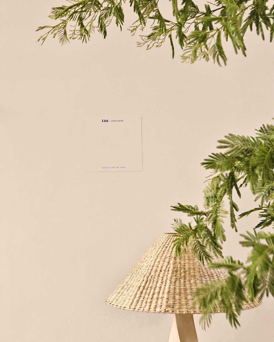 Image of a Lick Beige 02 Soho Farmhouse peel-and-stick sample on a wall decorated in Lick Greige 02 paint shade