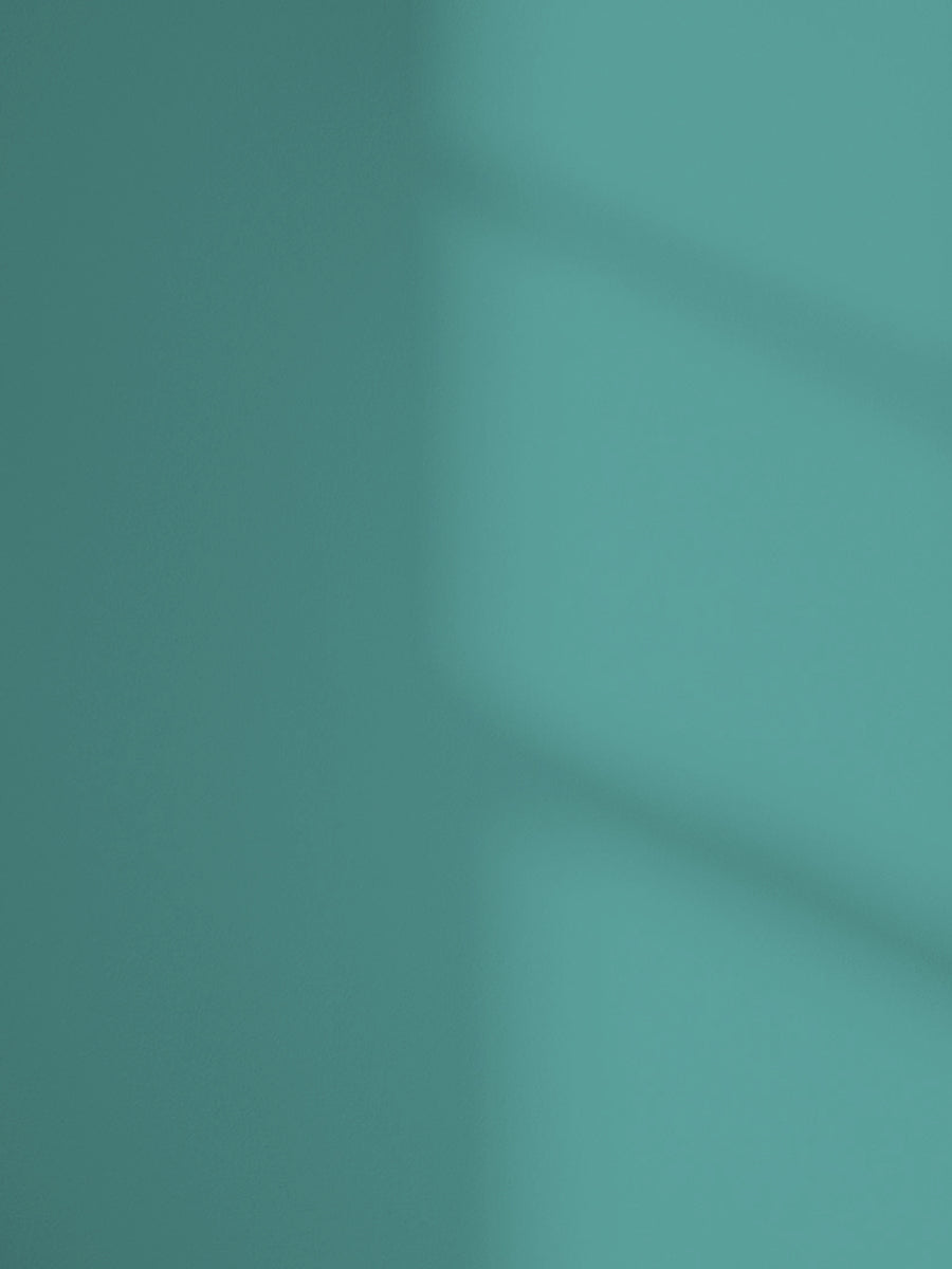 Lick Teal 06 paint shade on the wall with shadow