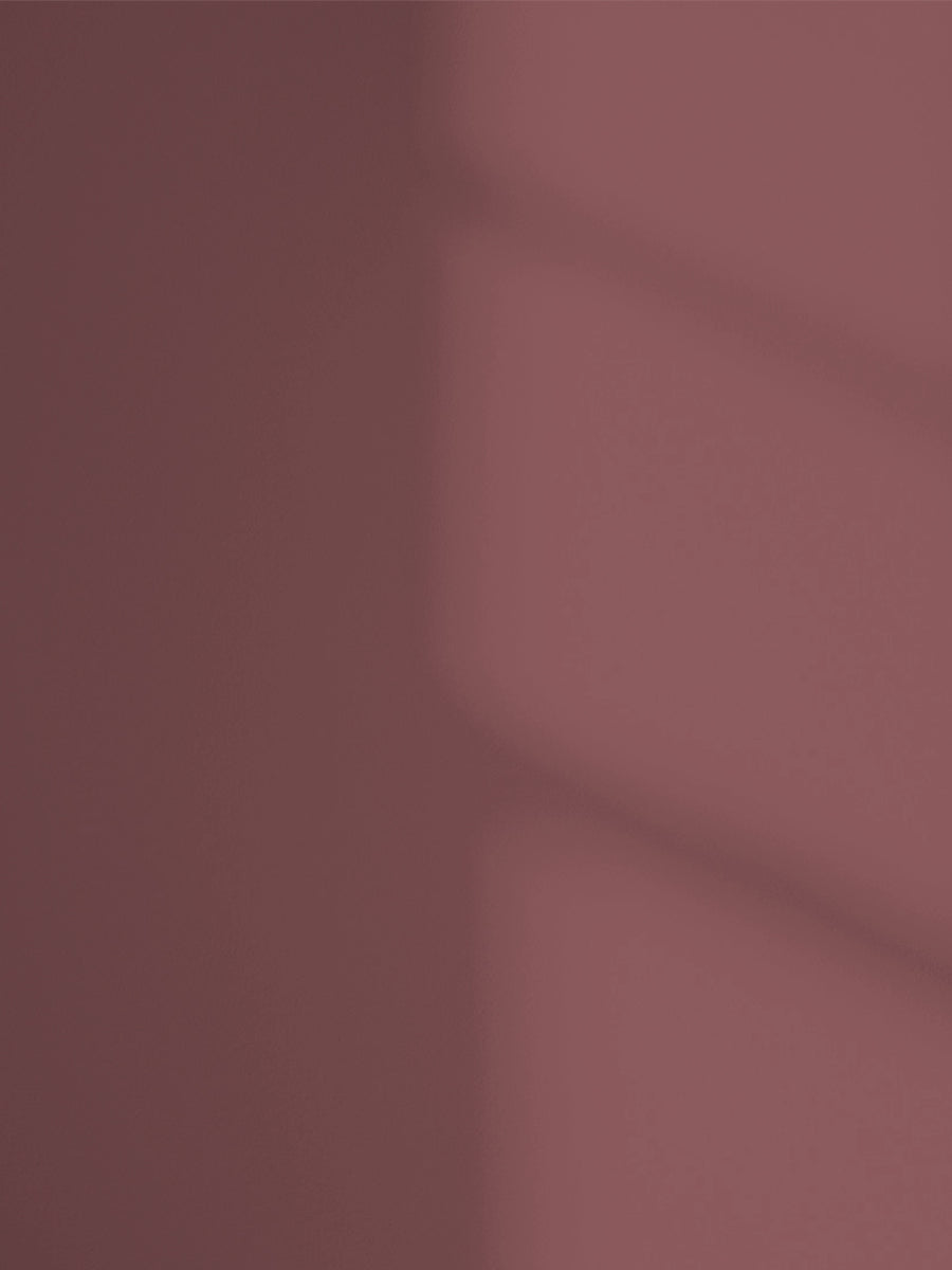 Lick Red 06 paint shade on the wall with shadow
