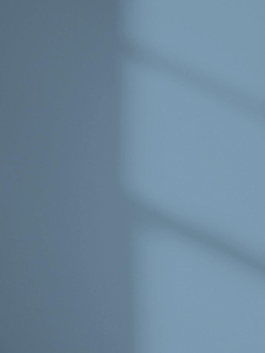 Lick Blue 18 paint shade on the wall with shadow
