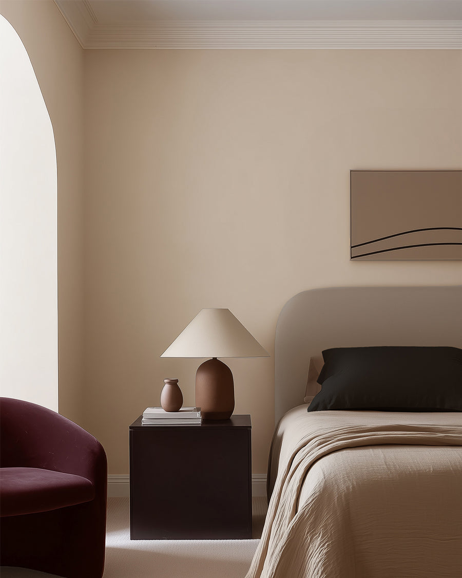 Bedroom painted in Lick Beige 09