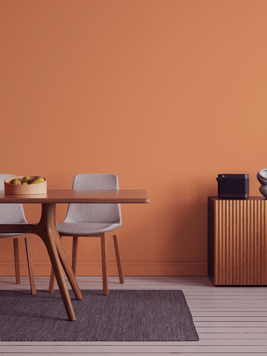 Dining room decorated in Lick Orange 04 paint shade