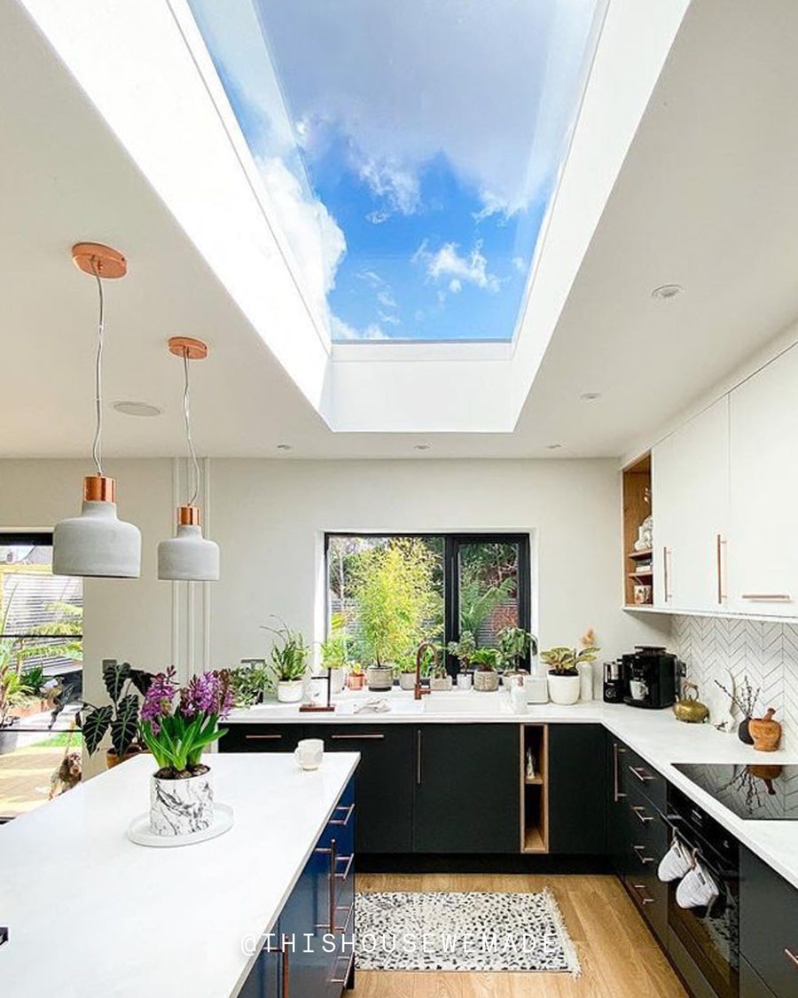 A light and bright kitchen with skylight decorated in White 01