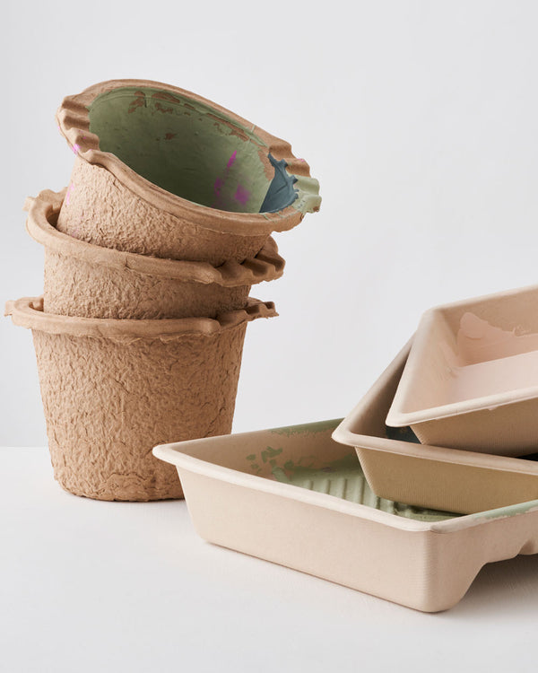 Stack of Lick pulp kettles and paint trays